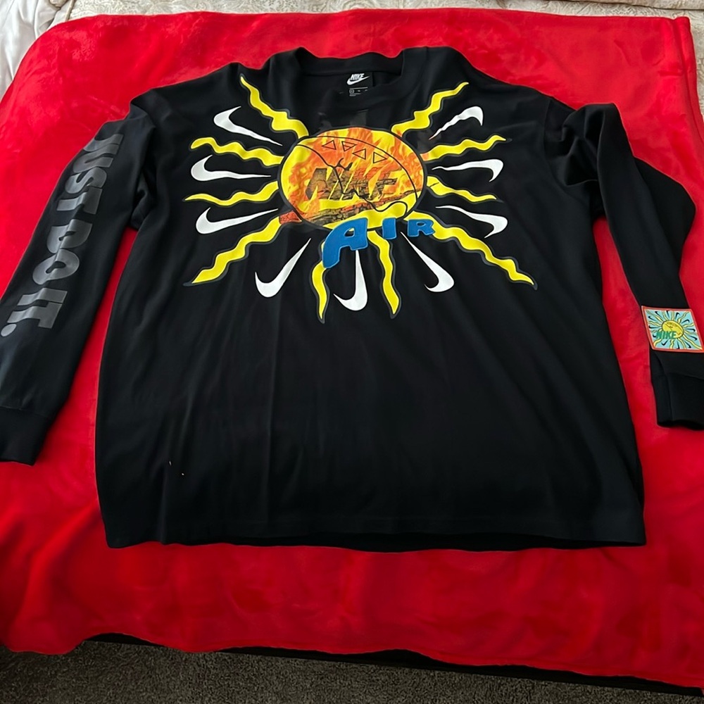 Black and Yellow Long Sleeve Nike Shirt with graphic designs